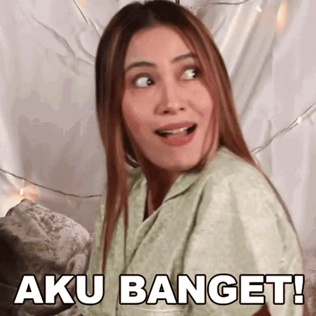 a woman with a surprised look on her face has aku banget written on her face