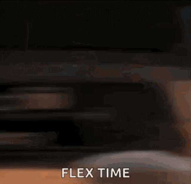 a blurred image of a person holding a cup of coffee with the words `` flex time '' written on it .