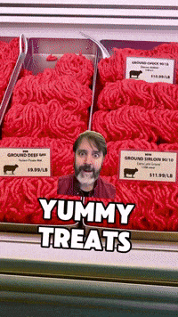 a picture of a man in front of a display of ground beef