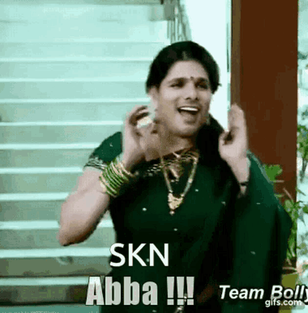 a woman wearing a green saree says skn abba
