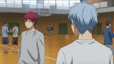 a man with red hair is standing next to a man with blue hair on a basketball court