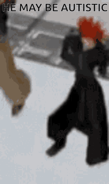a blurred image of a person with the words he may be autistic above them