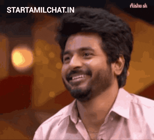 a man with a beard is smiling with the words starttamilchat.in written above him .