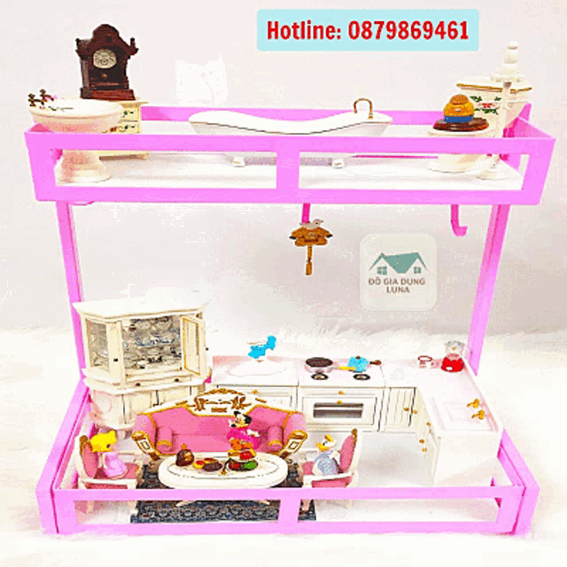 a pink display with a piano and a sign that says hotline
