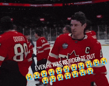 a hockey player in a red jersey with the number 8 on it