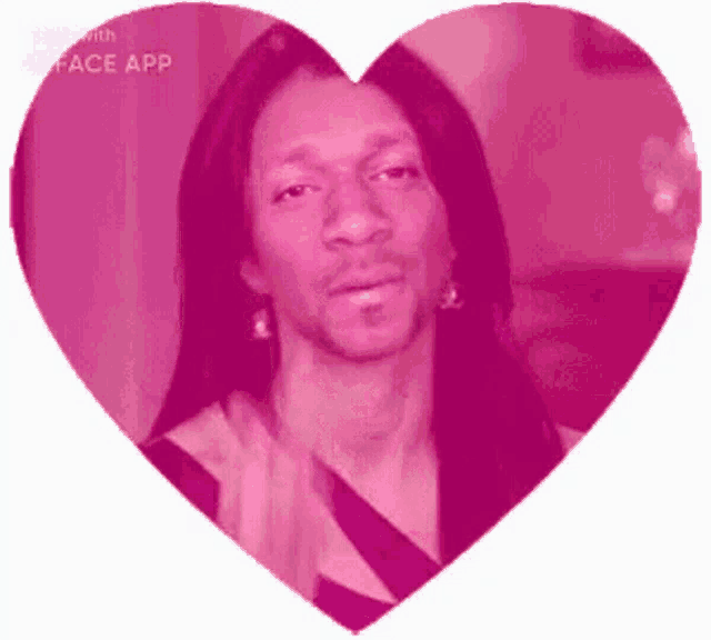 a man with long hair and a beard is in a pink heart