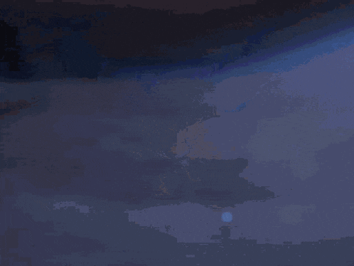 a person is holding a glowing sword in their hand ..