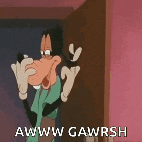 goofy is standing in front of a door and making a face .