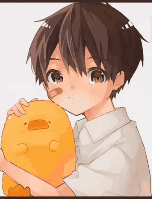 a boy with a bandage on his face is holding a stuffed yellow duck