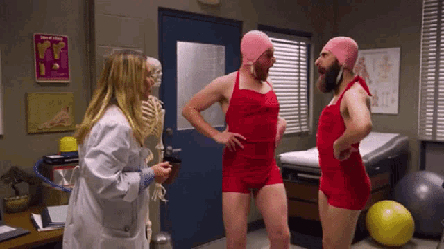 a man in a red bathing suit talks to a doctor