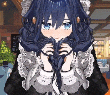 a girl in a black and white dress holds her hair in her hands