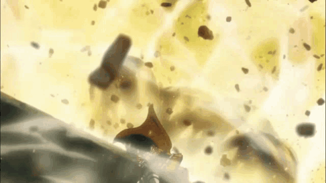 a person is flying through the air with a lot of rocks flying in the air .