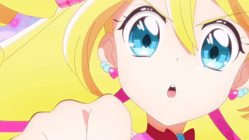 a close up of a girl pointing with her finger
