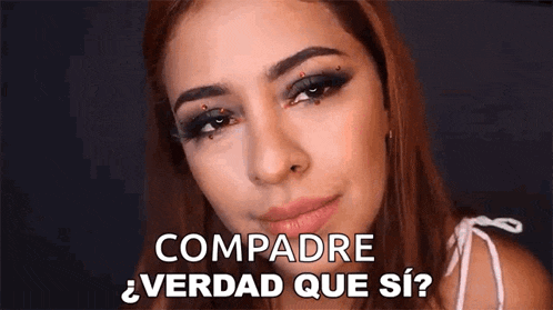 a close up of a woman 's face with the words compadre verdad que si written on her face .