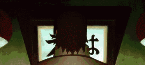 a silhouette of a person standing in front of a window with chinese writing on it .