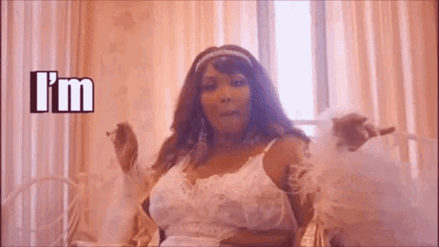 a woman in lingerie is smoking a cigarette in a room .