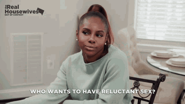 a woman is sitting at a table with the words who wants to have reluctant sex