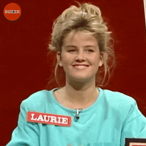 a woman in a blue shirt has a name tag that says laurie