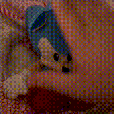 a close up of a person 's hand with a hello kitty on it