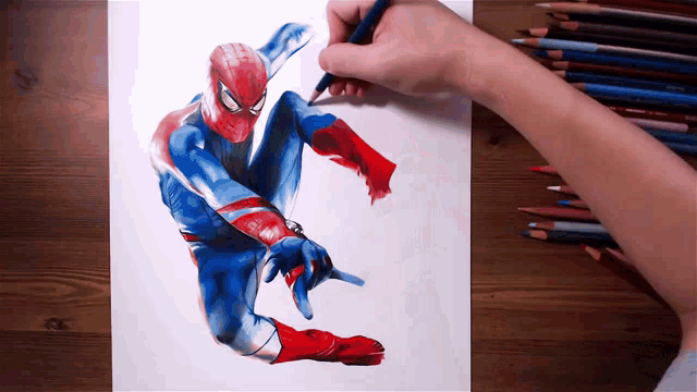 a person is drawing a picture of a spiderman with colored pencils