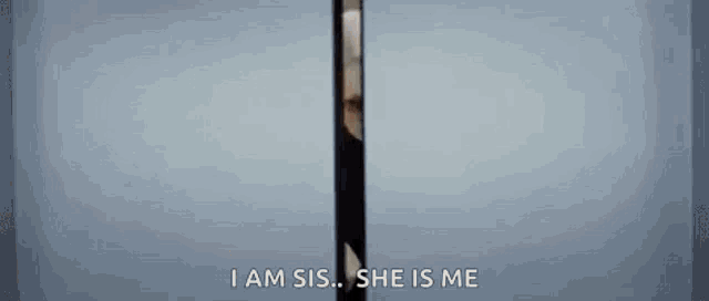 a woman is standing in a doorway with a cell phone in her hand and talking to someone .