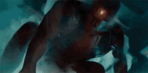a painting of a monster with a red light coming out of its eyes .
