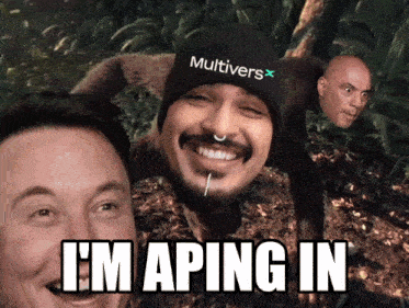 a man wearing a beanie that says multivers on it is smiling