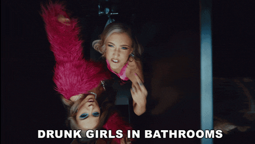 two drunk girls are in a bathroom with the words drunk girls in bathrooms above them