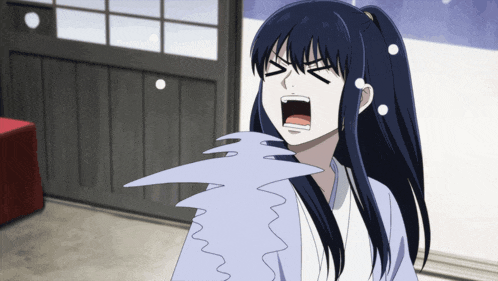 a girl with long black hair is screaming with her mouth wide open