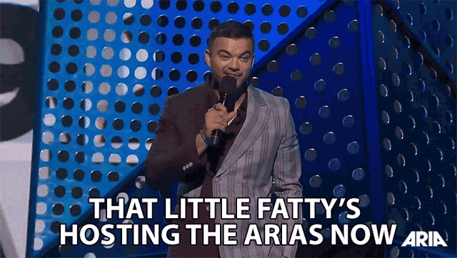 That Little Fattys Hosting The Arias Now Hosting GIF - That Little Fattys Hosting The Arias Now Hosting Host GIFs