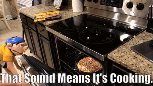 a stove top oven with a pizza in it and the words that sound means it 's cooking below it