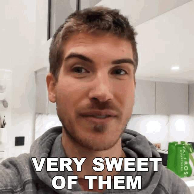 a man says very sweet of them in front of a green bag