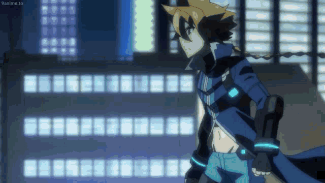 a man in a blue jacket is standing in front of a building with the website 9anime.to visible in the corner