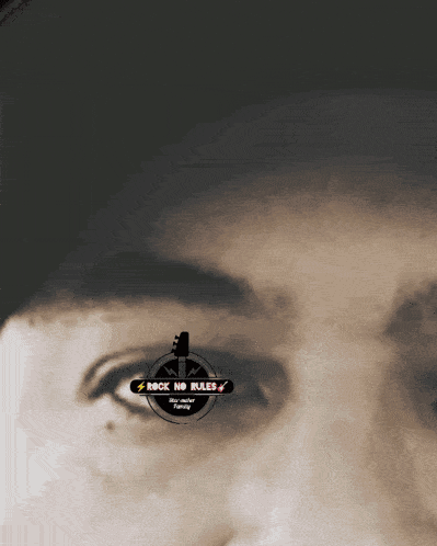 a close up of a person 's eye with the words rock no rules on the bottom