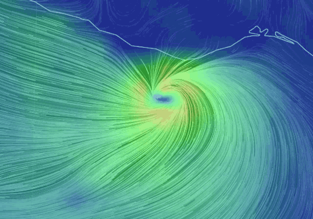 a computer generated image of a swirl of green and blue lines