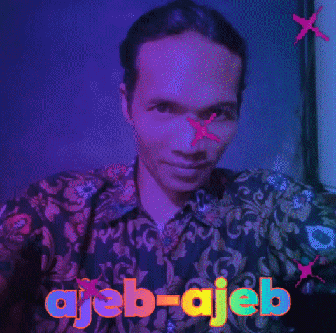 a man in a green shirt with ajeb-ajeb written on the front