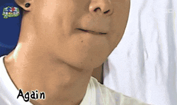 a close up of a man 's face with the word again written on it