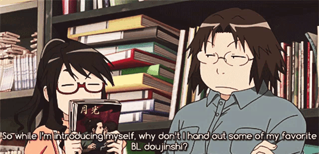 a man and a woman are talking in front of a stack of books and the woman is holding a book