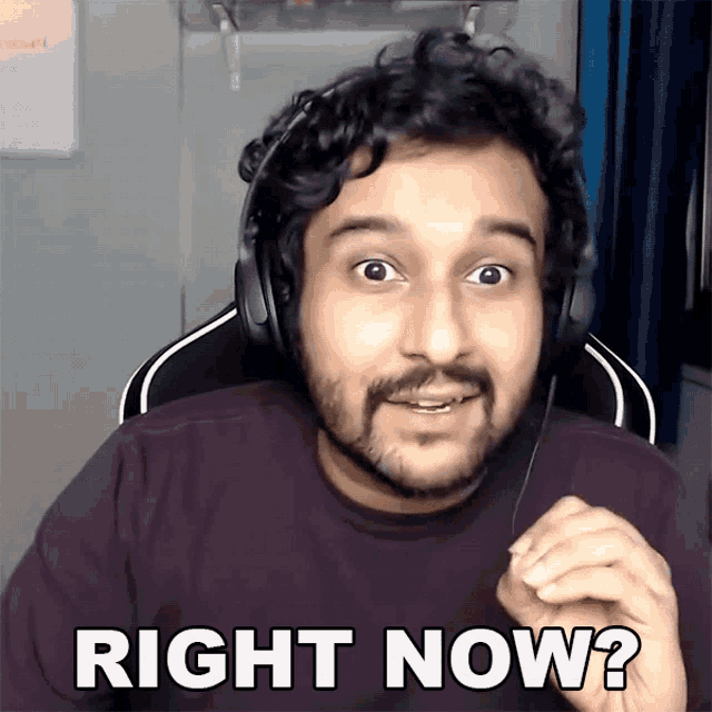 a man wearing headphones is making a funny face and says right now