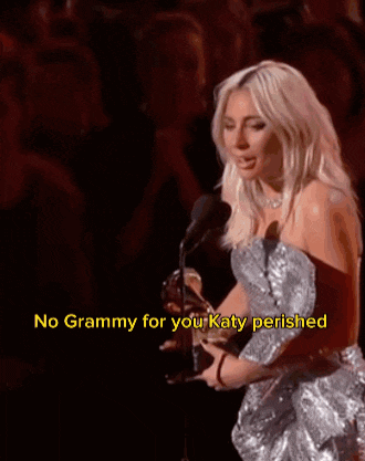 lady gaga is holding a grammy in front of a crowd and says " no grammy for you katy perished "