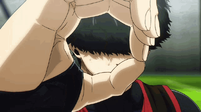 a person making a circle with their hands covering their face