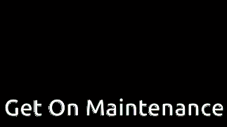 a sign that says " get on maintenance " in front of a wooden fence
