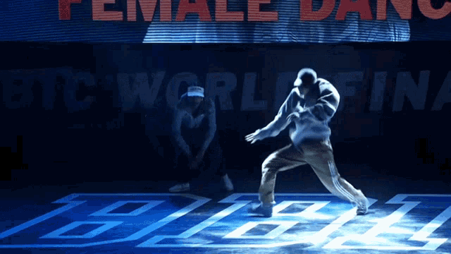 a man is dancing in front of a sign that says " female dance "