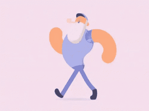 a man with a beard is walking and smoking a pipe while wearing headphones .