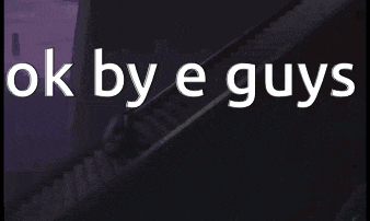 a sign that says ok by e guys with a staircase in the background