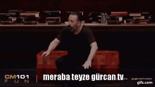 a man is sitting on a red box with the words meraba teyze gurcan.tv written on the bottom