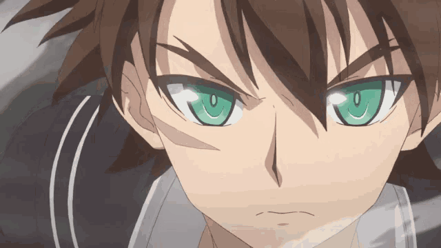 a close up of a boy with green eyes