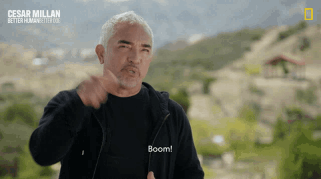 a man in a black jacket says boom in a national geographic video