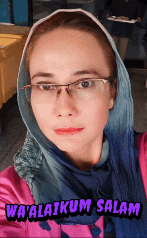 a woman wearing glasses and a scarf with the words wa'alaikum salam above her