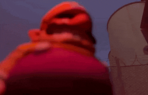a close up of a cartoon character 's mouth with a red background